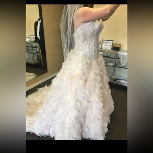 Brand new, never worn wedding dress in champagne color.